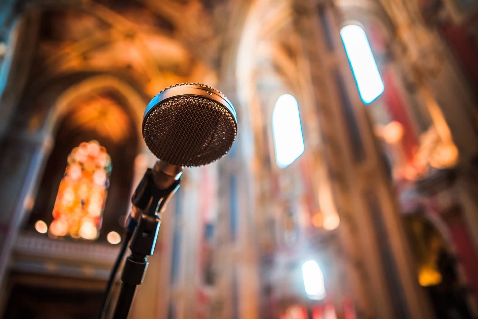 Microphone set against the softly lit cathedral interior